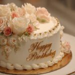 Elegant white happy birthday cake with floral design, roses made of cream, royal theme, luxury bakery style, sharp focus, ultra-realistic 4K image
