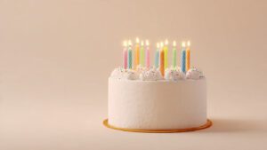 Minimalist happy birthday cake with simple candles, clean background, modern aesthetic, soft natural lighting, ultra-realistic, 4K quality